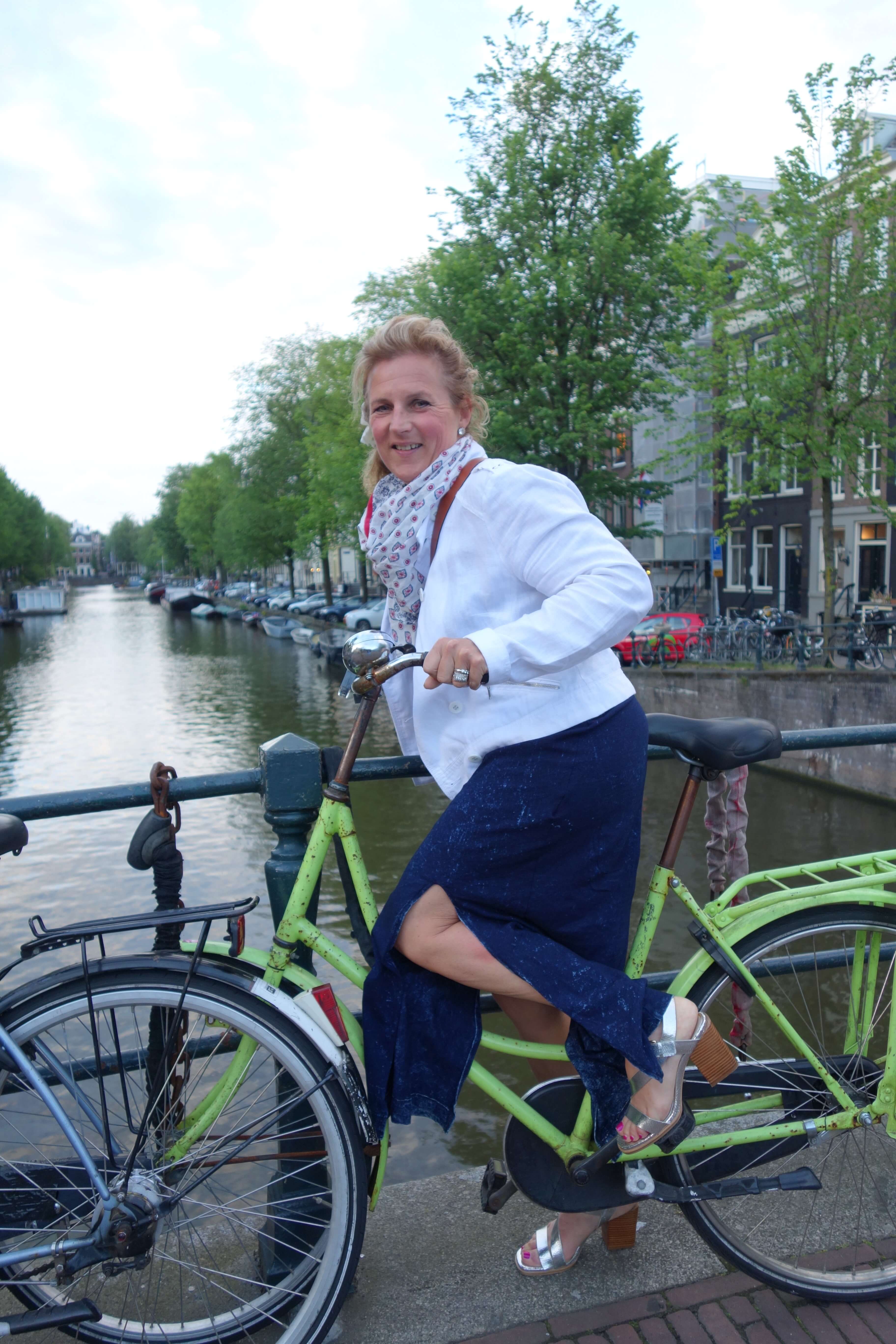 Jennifer Ryan enjoying a bike ride in Amsterdam, showcasing her adventurous spirit